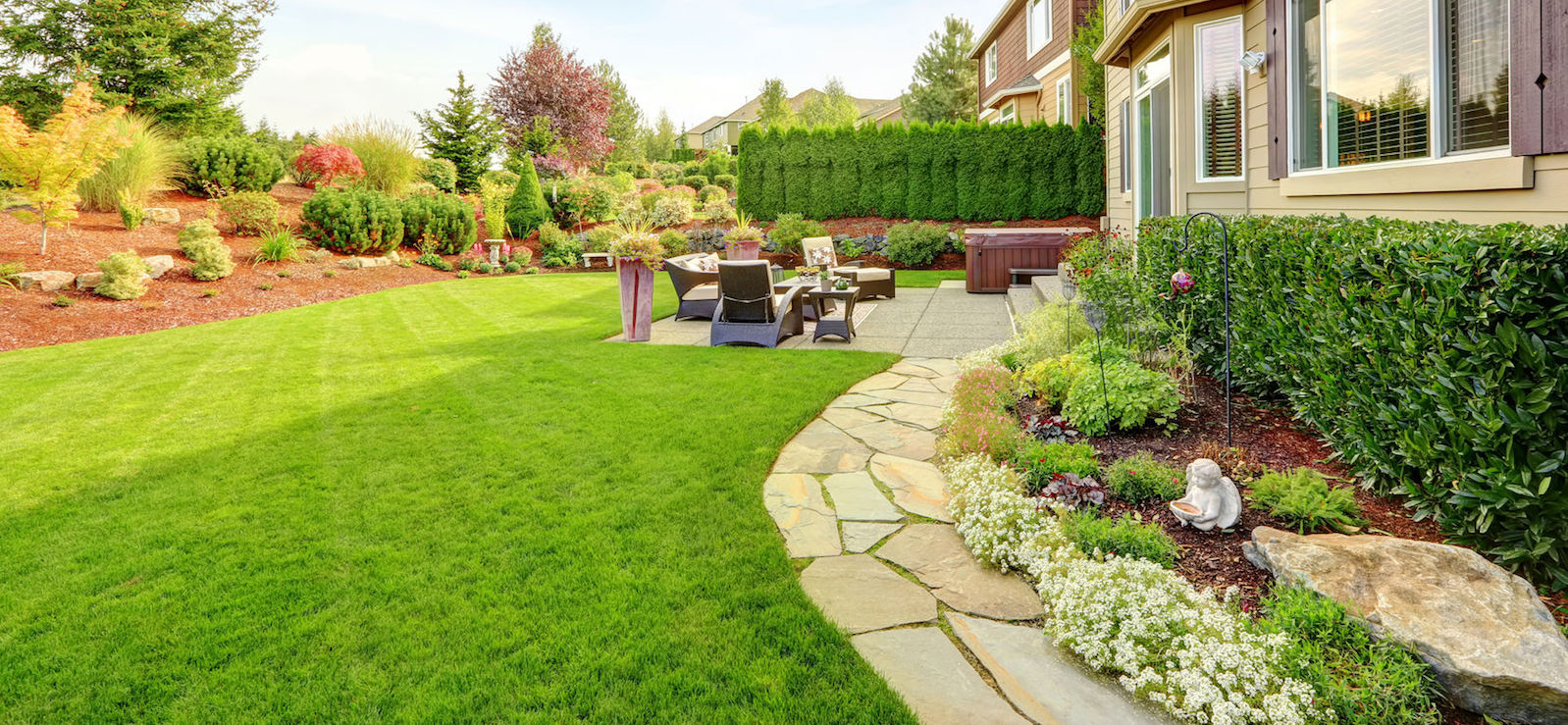 impressive backyard landscape design with cozy patio area